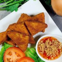 Golden Tofu · Crispy firm tofu with breadcrumb. Served with sweet chili sauce mixed with crush peanut.