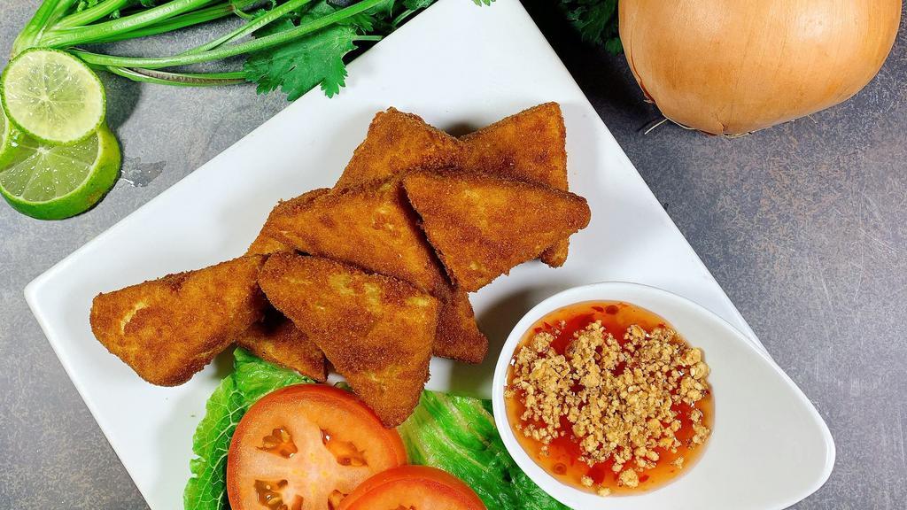 Golden Tofu · Crispy firm tofu with breadcrumb. Served with sweet chili sauce mixed with crush peanut.
