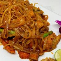 Pad Thai · Stir fried Thai rice noodles with egg, bean sprouts, chive, ground peanuts, lime and tamarin...