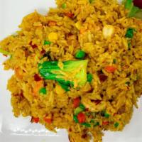 Curry Fried Rice · Fried rice with yellow curry sauce, peas, carrots, corns and bok-choi.