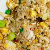Thai Crab Fried Rice · Thai fried rice with lump meat crab, egg, peas, carrots, corn. Served with lime.