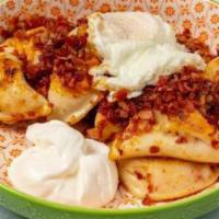 Breakfast Perogies · Pan-seared Potato and Cheddar Perogies, tossed with Pepe's Seasoning, crisp Bacon pieces, ch...
