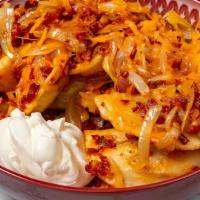 Canadian Perogies · Pan-seared Potato and Cheddar Perogies, tossed with crisp Bacon pieces, sauteed onions, and ...
