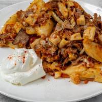 The Works Perogies · Pan-seared Potato and Cheddar Perogies, served with sauteed diced steak, chicken, onions, pe...