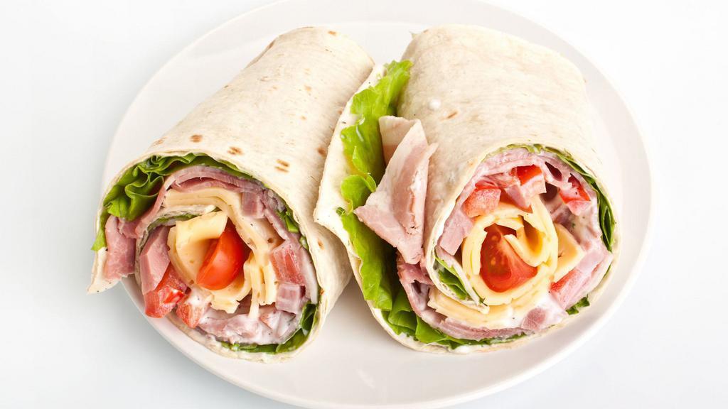 Rogi Blt Wrap · Our take on the American classic. Delectable wrap with plenty of bacon, fresh romaine, and ripened tomatoes. Garnished with an avocado lime aioli.