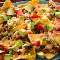 Beef Nachos · Flavorful beef with sautéed onion and peppers and topped with melted cheese loaded onto cris...