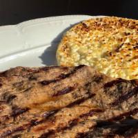 Carne Asada, Arepa Con Queso · Most popular. Roasted meat, corn cake and cheese.