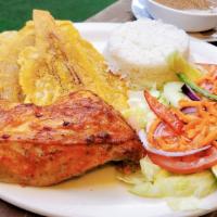 Pollo Al Horno-Baked Chicken · Roasted chicken. Rice, salad, beans and fried plantains.