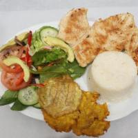 Pechuga A La Plancha · Grilled chicken breast. Rice, salad and fried plantains.