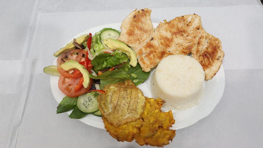 Pechuga A La Plancha · Grilled chicken breast. Rice, salad and fried plantains.