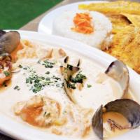 Cazuela De Mariscos · Seafood casserole. Fried plantains and rice.