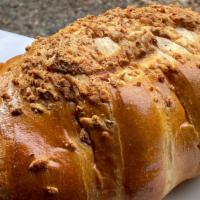 Pan De Queso (Grande) - Cheese Bread (Large) · Bread topped with cheese and a cheese filling