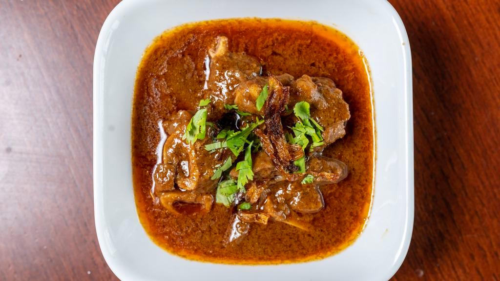 Goat Korma · Rich spicy curry dish comes with yogurt and onions sauce.