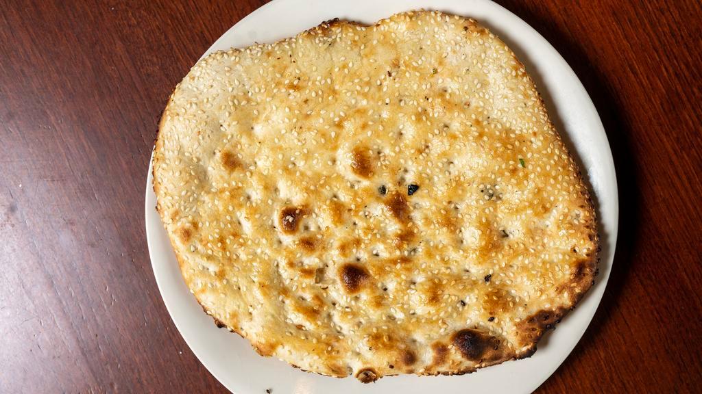 Rongni Naan · Soft white flour bread topped with sesame seeds.
