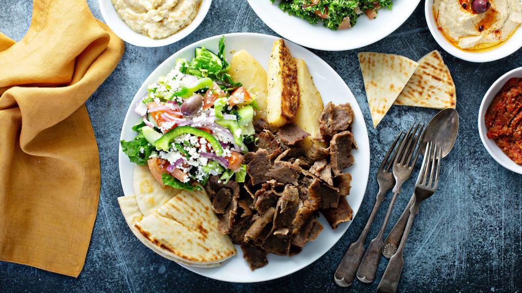 Classic Beef & Lamb Gyro Plate · Sizzling slices of gyro meat served with customers choice of two sides.
