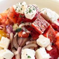 Classic Greek Salad · Heirloom tomatoes, vine ripe tomatoes, cucumbers, onions, olives, bell peppers, feta, white ...