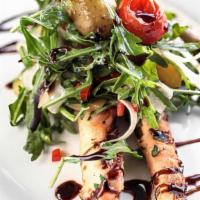 Grilled Octopus Salad · Yukon gold potatoes, pickled grape tomatoes, and black olives.