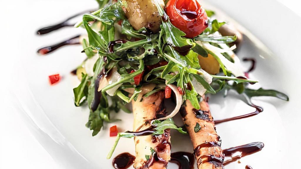 Grilled Octopus Salad · Yukon gold potatoes, pickled grape tomatoes, and black olives.