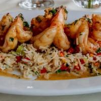 Jumbo Prawns · White wine, garlic, with a little spice, served with basmati pilaf.