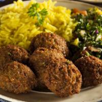 Falafel Over Rice · Crispy falafel served with shredded lettuce, diced tomatoes, chopped onions and house made t...