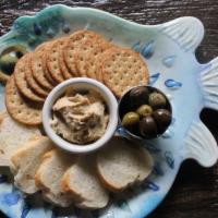 Hummus And Cracker Board · Roasted garlic hummus and crackers. Gluten-free crackers available.