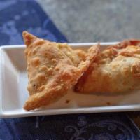 Samosa · Served with onion chutney and green coriander sauce. Choice of rice. Two pieces vegetable, t...