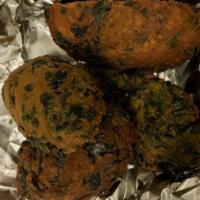 Sahina · Spinach and lentil peas patties and gluten-free. Served with onion chutney and green coriand...