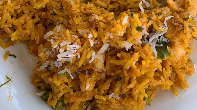 Lobster Biriyani
 · 1/2 lb. lobster tail meat. Cooked with saffron or brown rice, mild spices with coconuts on top. Served with dal, cabbage, onion chutney and coriander sauce.