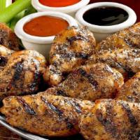 Smoked Wings · Wings are slow-smoked, then finished on the grill. May be tossed in sauce or ordered with sa...