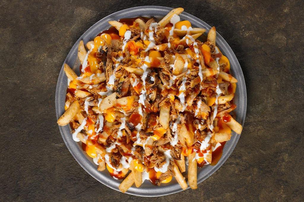 Loaded Bbq Shack Fries · Fries loaded with Shredded Cheddar Jack Cheese, BBQ Pork or Chopped BBQ Chicken, Original BBQ Sauce, and topped with Ranch Dressing. Jalapeños served on the side by request.