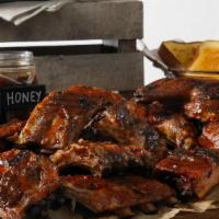 Pit Master Package · 2 Half Racks of Ribs, 2 Smoked Half Chickens, 1 lb Chopped BBQ Pork, 3 Pint Sides, Bread, & ...