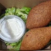 Kibbeh · bulgur croquettes fried and filled with ground beef with side of yogurt-tahini sauce (qty 2).