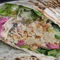 Falafel Wrap · with lettuce, tomato, pickles & yogurt-tahini sauce. vegan option available upon request.