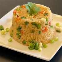 Arroz Chaufa Rice · Rice sautéed with GF soy sauce, red onions, red peppers, peas, carrots and fresh green onion...