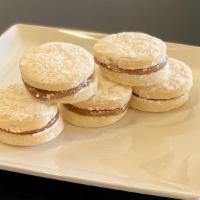 Alfajores Cookies (6 Pack) · Peruvian shortbread sandwich cookies filled with dulce de leche and dusted with powdered sug...