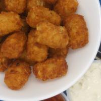 Tater Poppers · Tater tots baked in Popper sauce of your choice (Popper sauce options- Buffalo sauce, teriya...