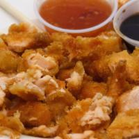 Salmon Poppers · Tempura battered salmon bites, topped with popper sauce of your choice. (Popper sauce option...