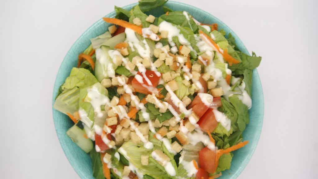 Garden Salad · lettuce, cucumber, carrot, tomato, mixed with homemade Creamy Italian dressing, topped with onion garlic croutons.