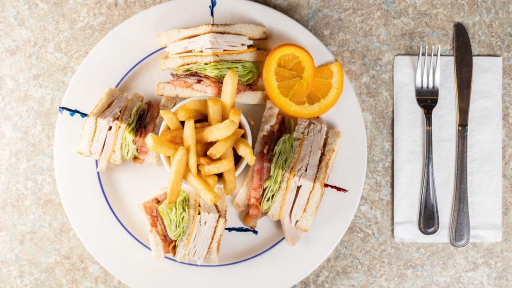Turkey Club · All white meat turkey, bacon, lettuce, and tomato. Served with French fries.
