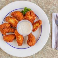 Buffalo Wings · Seven pieces. With blue cheese dressing.