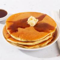 Buttermilk Pancakes · Three fluffy buttermilk pancakes served with maple syrup