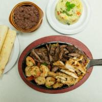Tita'S Mixed Fajitas · Chicken, steak and shrimp with grilled onions, peppers, tomatoes served with flour tortillas...