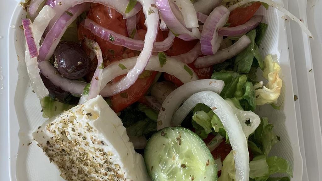 Greek Salad · Romaine lettuce, tomatoes, cucumbers, red onions, kalamata olives and Greek feta cheese.
served with bread of your choice.
