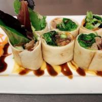 Duck Roll · Roasted duck meat, cucumber, carrot and asparagus wrapped in tortilla roll with honey mustar...