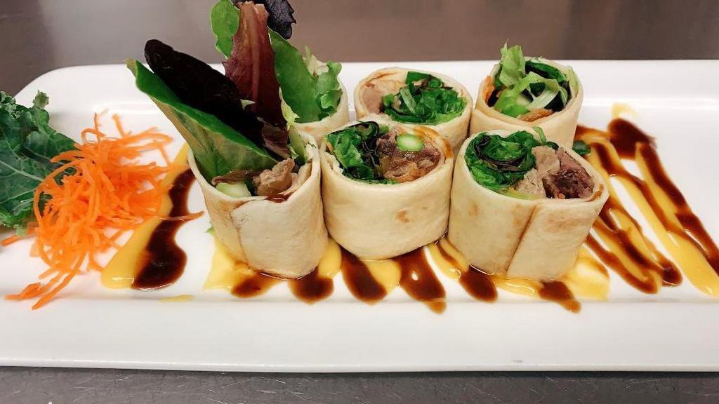Duck Roll · Roasted duck meat, cucumber, carrot and asparagus wrapped in tortilla roll with honey mustard hoisin sauce.