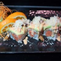 Beauty And The Beast Roll · Raw. Spicy tuna roll, topped with salmon, eel, avocado and crunchy flakes with spicy eel sau...