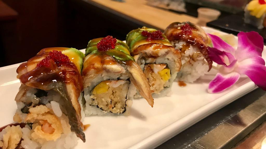 Carpe Diem Roll · King crab, shrimp tempura and mango topped with eel, avocado and red tobiko.