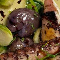 Grilled Octopus  · Served with boiled rustic potatoes & turnip greens.