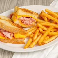 Ham Melt · Thinly sliced smoked Virginia ham, American cheese, and tomatoes. Served on grilled sourdoug...