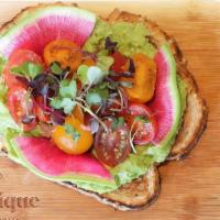 Avocado Smash · Avocado with watermelon radish, marinated tomatoes, chili oil, microgreens on multigrain toa...